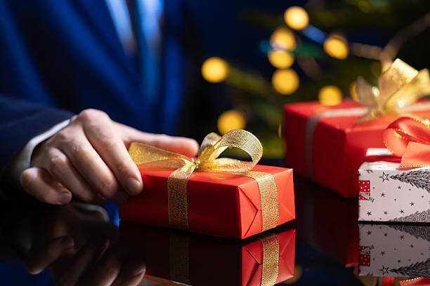 istock Business gift exchange during Christmas season 2239563850