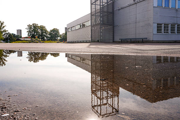 A close-up of a puddle on parking lot
