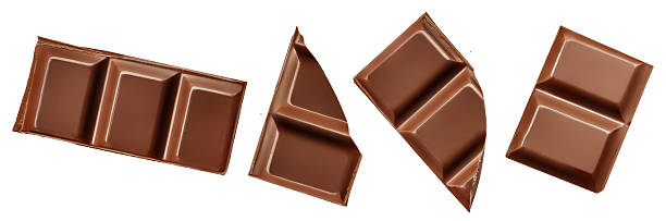 istock Broken chocolate bar pieces isolated on white. High-Quality Chocolate chunks with scattered  cocoa crumbs Top view. Flat lay. Colection 2239565567