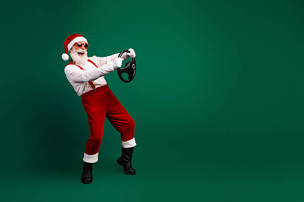 istock Santa Claus striking a funny pose while holding a steering wheel on a green background with festive holiday vibes 2239565939