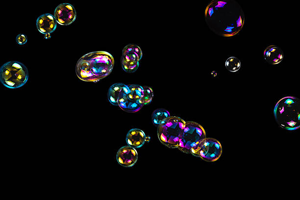 istock Soap bubbles isolated on a black background. 2239571405