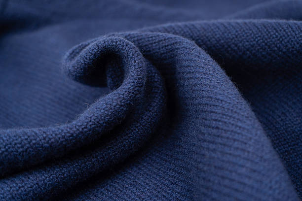 istock Navy blue merino wool sweater texture as background. Top view. 2239571472