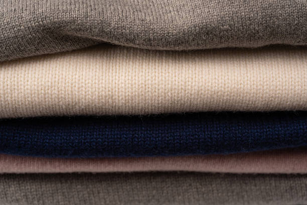 istock A group of warm sweaters isolated on a white background. 2239571488