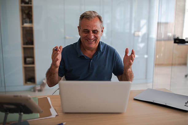 istock Older businessman in the office 2239576392