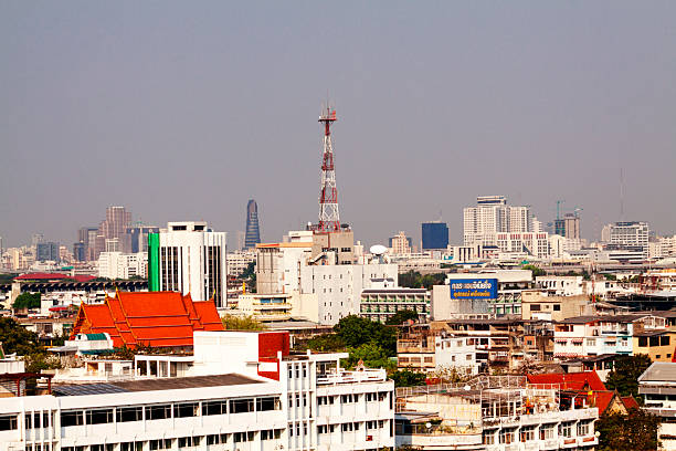 View over Bangkok's cityscape in inner old city. View from Golden Mountain Wat Saket / Golden Mountain. Wat Saket is one of oldest temples in Bangkok and placed on a hill and is located in district Pom Prap Sattru Phai. Wat Saket offers 360 degree lookout of inner Bangkok