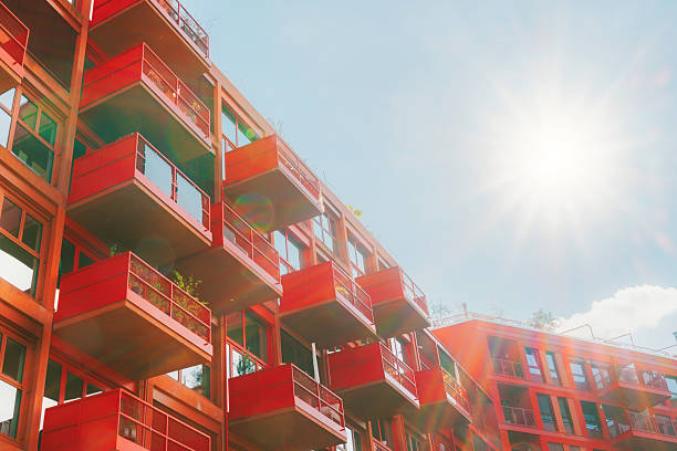 istock modern red facade with cubic balconies in backlit 2239579609