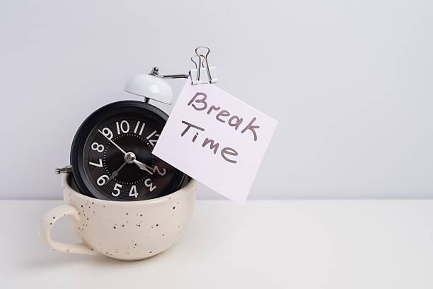 istock Coffee and clock on a colored background.  Time to drink coffee. Break time. Creative idea. 2239584195