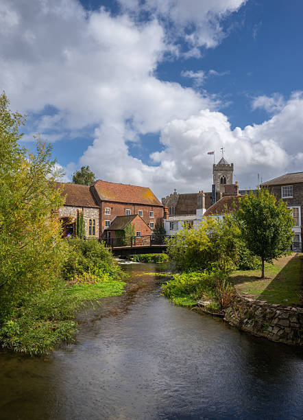 Salisbury, Wiltshire, UK:  The River Avon in central Salisbury seen from Fisherton Street with St Thomas's Church in the background.