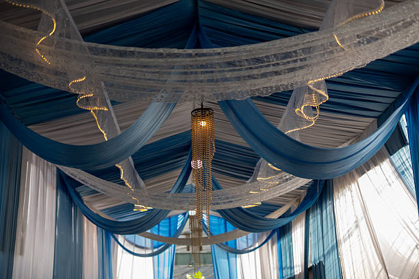 istock Elegant Blue and White Fabric Drapes with Crystal Chandelier Lighting 2239584958