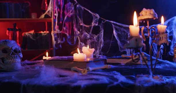 istock Halloween Haunted Table with Skull and Candles 2239586453