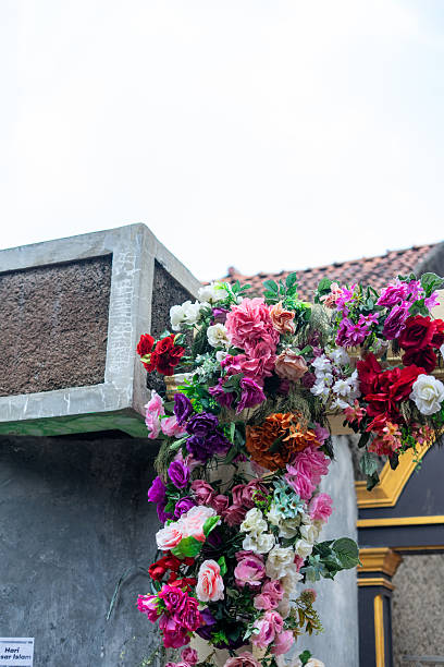 istock Vibrant Artificial Flower Display on Outdoor Structure 2239587365