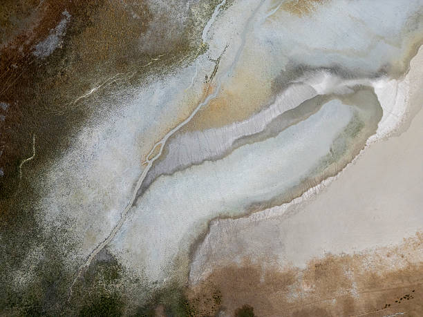 Natural shapes and textures formed where the river flows into the lake