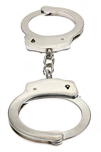 istock metal handcuffs isolated on white background 2239589346