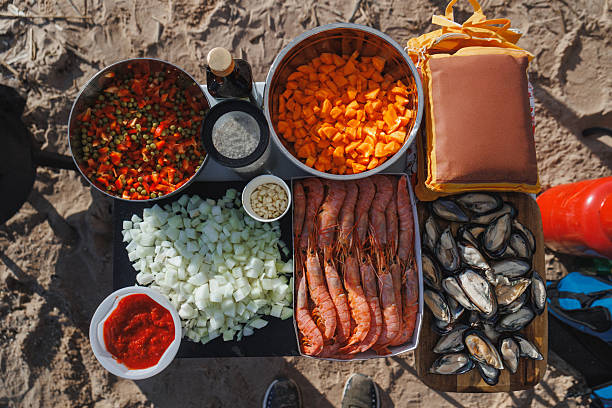 On the table, there are many distinct and various types of food available
