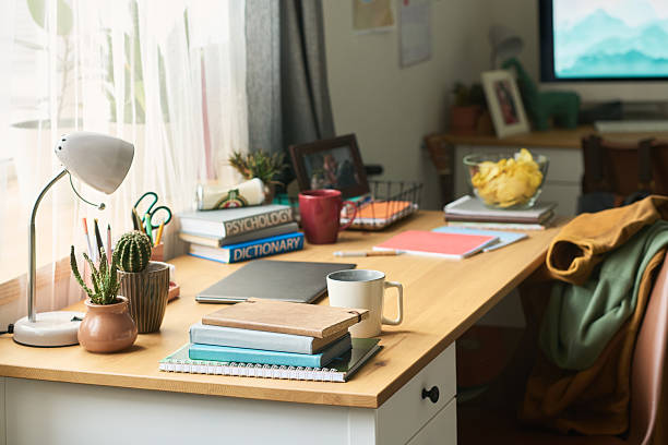 istock Organized Home Office Desk Featuring Books and Stationery in Daylight 2239590749