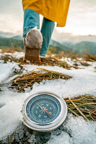 Mountain boots and hiking gear on wooden planks close up
