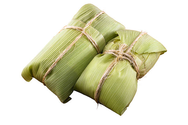 istock pamonha, brazilian corn sweet, packaged with straw, served in these juninas, on isolated white background 2239591995
