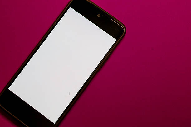 A smartphone with a clean white screen is positioned diagonally on a saturated pink (fuchsia) background, creating a vibrant, trendy contrast.