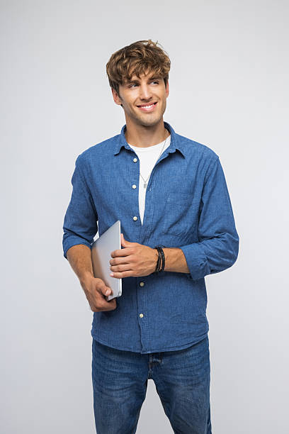 istock Portrait of confident young man 2239592637