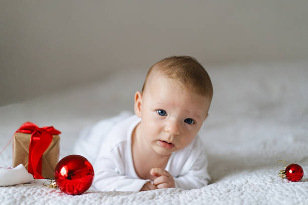 istock A baby wearing a red Santa hat 2239592673