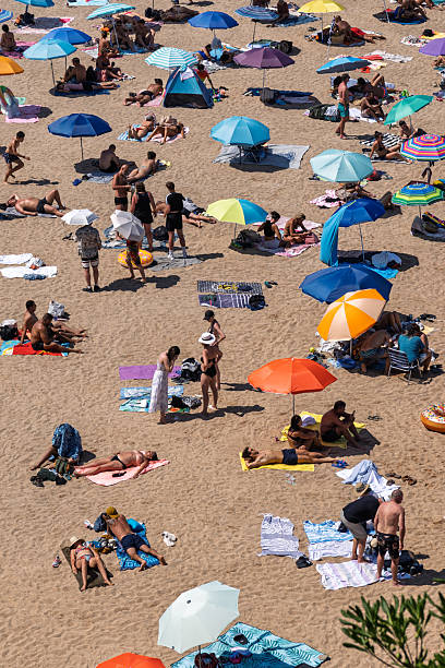 istock Girona, Spain-August 12, 2025. Crowded beach scene with umbrellas and sunbathers 2239594321