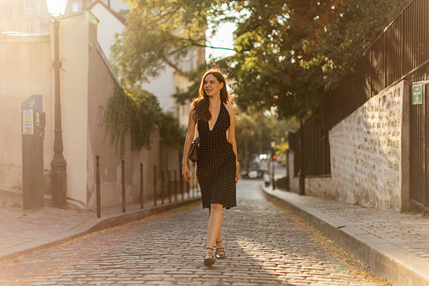 istock Beautiful young woman walking in Monmartre 2239595120