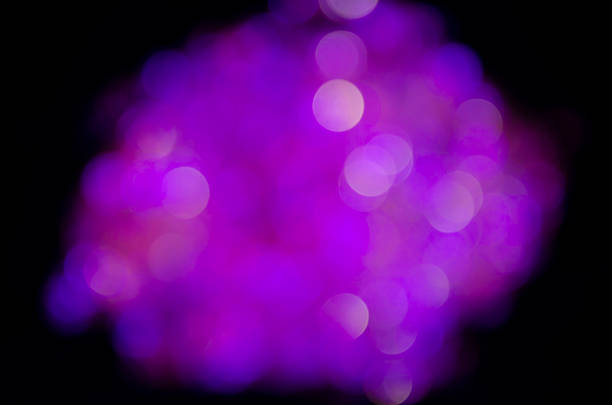 Purple  glow. Abstract background. Light and bokeh. Abstraction circles on a black background.