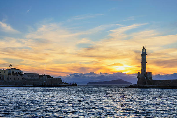 istock Venetian harbour and lighthouse at sunset in Chania 2239596711