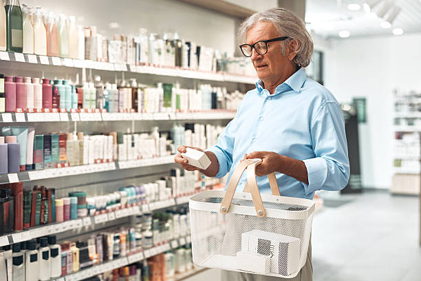 istock Senior man shopping in pharmacy aisle 2239597298