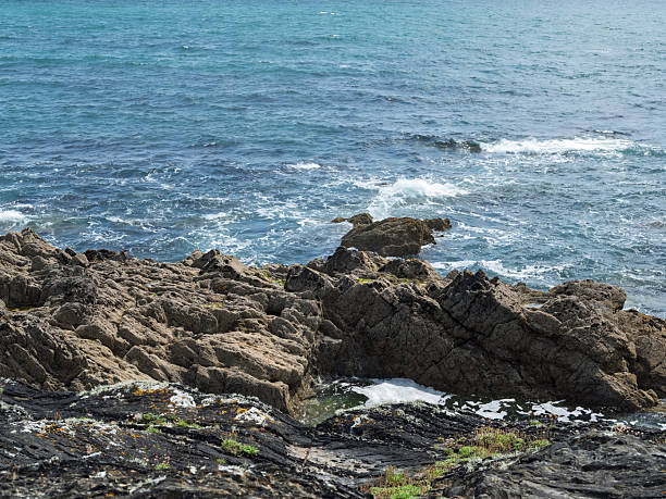 Waves breaking at Cap de la Chevre on a windy day in the Brittany region of France.