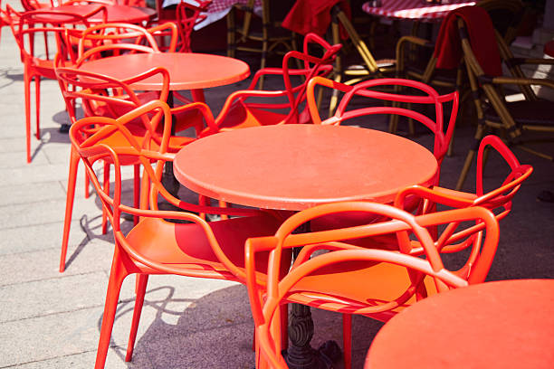 istock An outdoor cafe. The table and chairs are red 2239598932