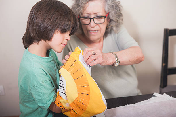 Grandmother teaching her granddaughter to knit, passing down traditional skills and creating a bonding moment