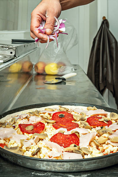 This style of pizza is characterized by having a thinner,