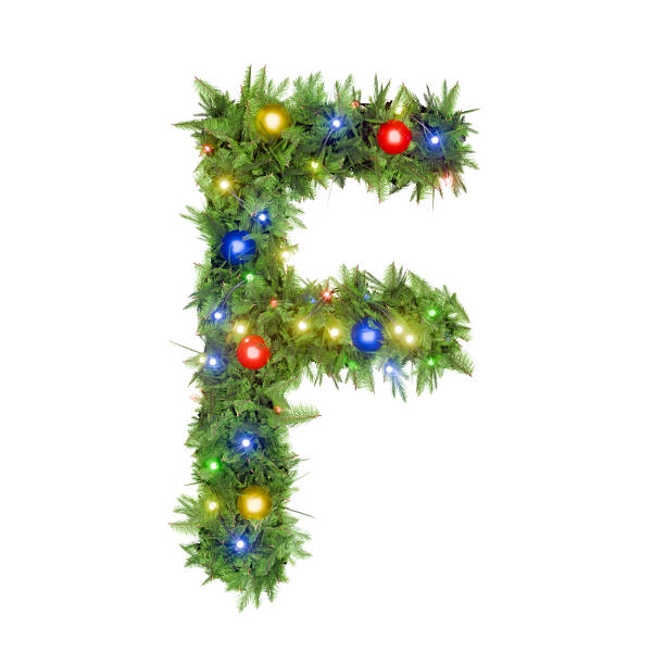 Christmas tree adorned with lights, letter F hanging on a branch.