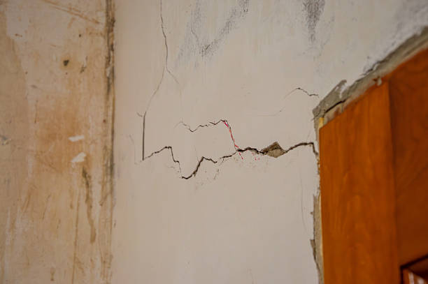 istock Cracks are seen on the wall of an older building, indicating damage and possible structural concerns needing attention 2239605209