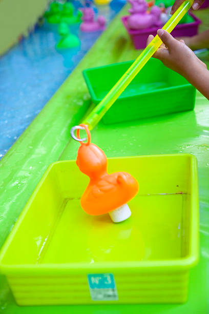 istock Rubber duck fishing game 2239607735