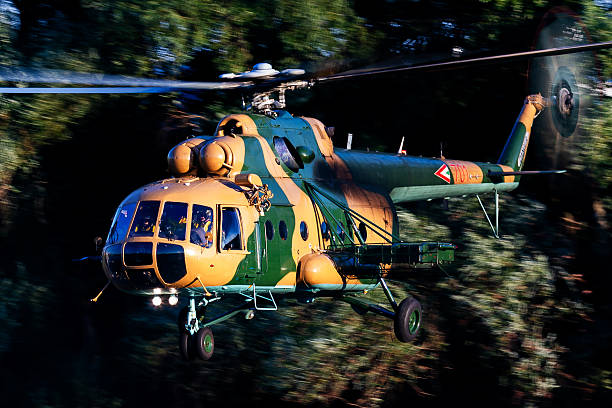 Attack helicopters flying over mountains