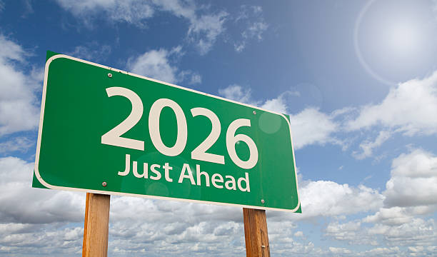 istock 2026 Just Ahead Green Road Sign Over Clouds and Blue Sky. 2239609076
