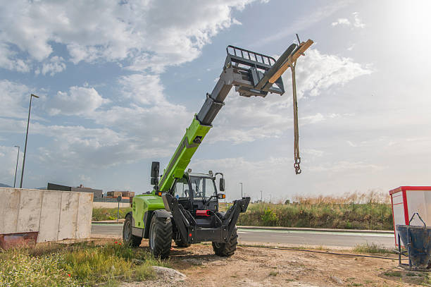 istock Forklift on a construction site, preparing to raise construction parts 2239609251