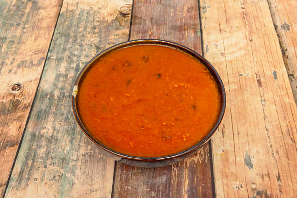 istock Rogan Josh: Lamb cooked in a deep red sauce, rich in spices, often with yogurt. 2239612920
