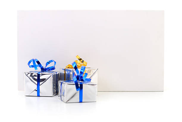 Close-up of white envelope with blue ribbon in mid-air, isolated on white with clipping path.