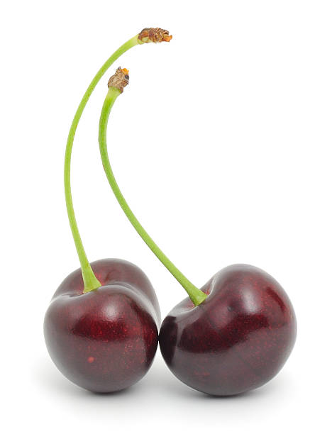 istock Two sweet cherries isolated on white background 2239618204