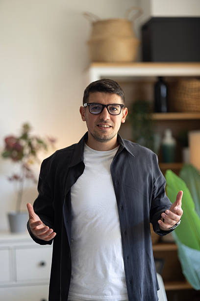 istock Pov entrepreneur talking camera interview in office. Online coach waving hand 2239618894