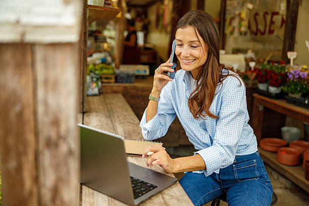 istock A Woman Engaged in Remote Work While Sitting in a Beautiful Garden Setting Today 2239620995