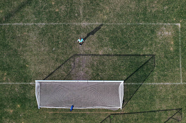 istock Man Playing Football 2239621117