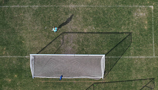 istock Man Playing Football 2239621132