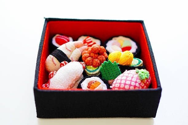 set with sushi from the store in plastic packaging on the table for dinner, there is sushi at the table at home, plastic disposable sushi packaging