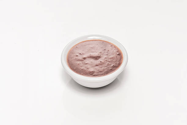 istock Small  pots with tomato and roasted garlic sauce, where caramelized garlic pieces are visible on the surface 2239624491