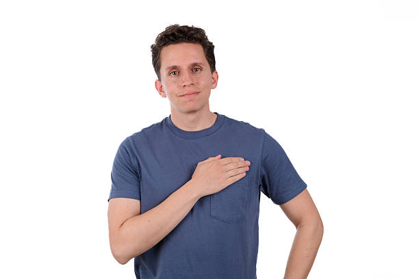 istock Proud man wearing a blue shirt on a white background, pointing at himself 2239624618