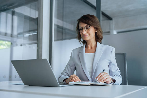 istock Middle-aged latin Hispanic woman using computer remote for business studying, watch online virtual webinar training meeting, video call. Mature european businesswoman working on laptop in office 2239626817